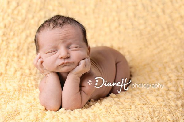 Newborn Baby Poses on Yellow Blanket