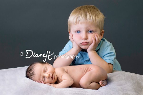 Newborn photo with sibling big brother